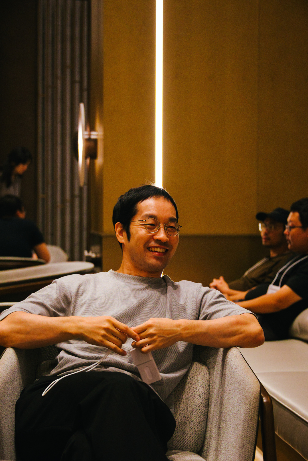 Portrait of a sitting man on a sofa in a hotel lobby